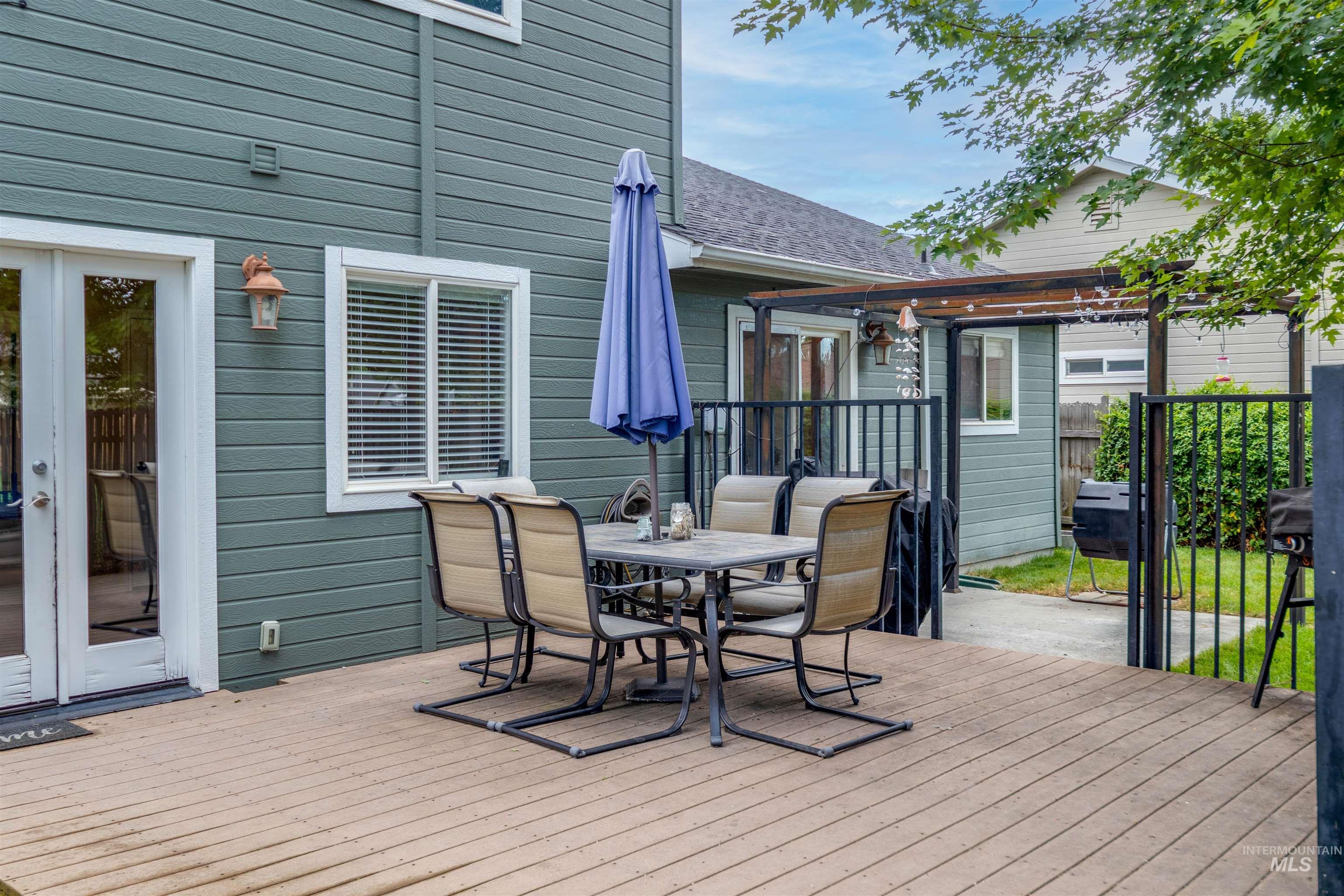 485 North Nebula Avenue Star, ID 83669 - Photo 33 of 47 Wooden deck with outdoor dining area and a pergola