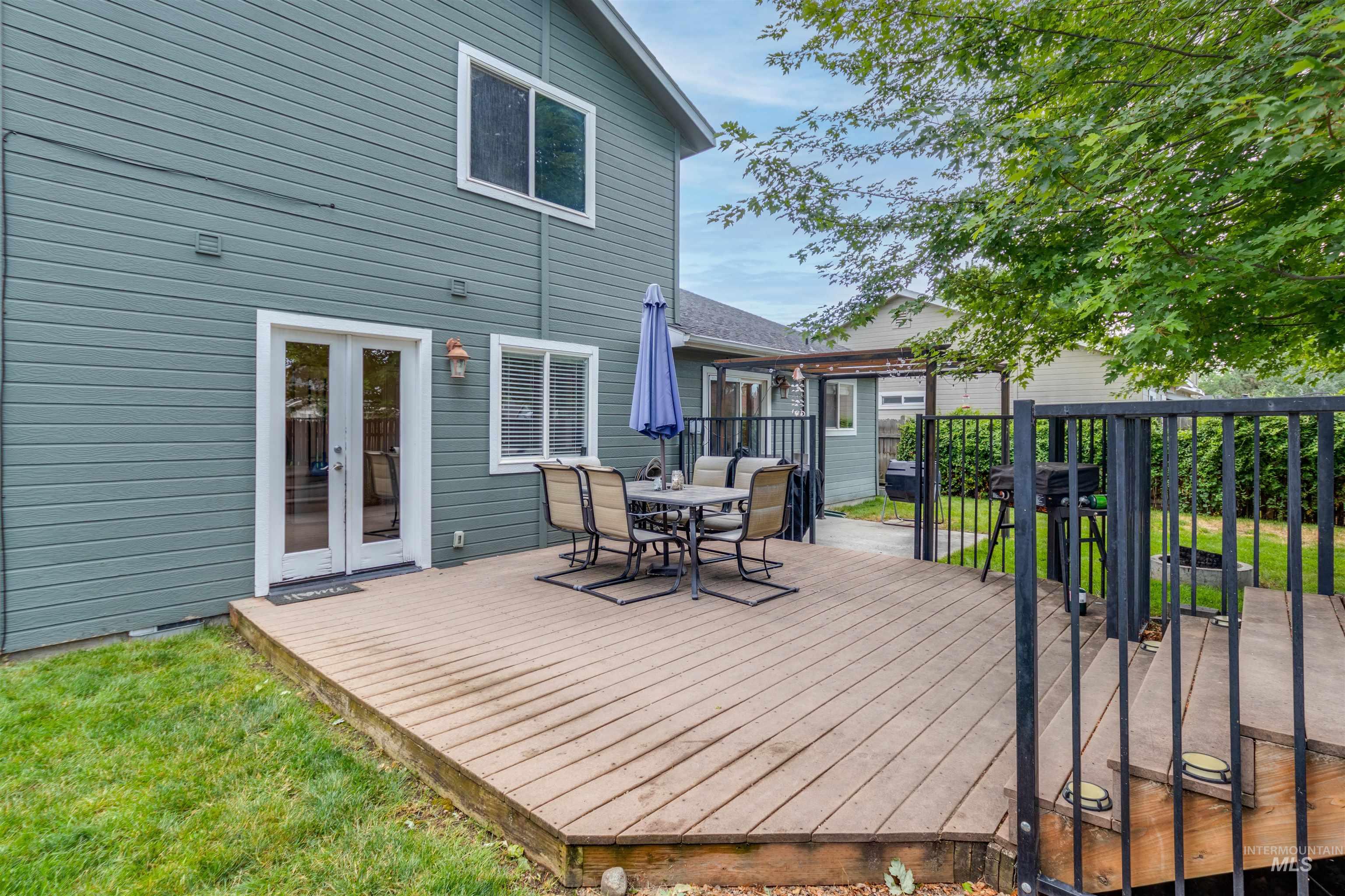 485 North Nebula Avenue Star, ID 83669 - Photo 35 of 47 Wooden deck featuring outdoor dining space and french doors