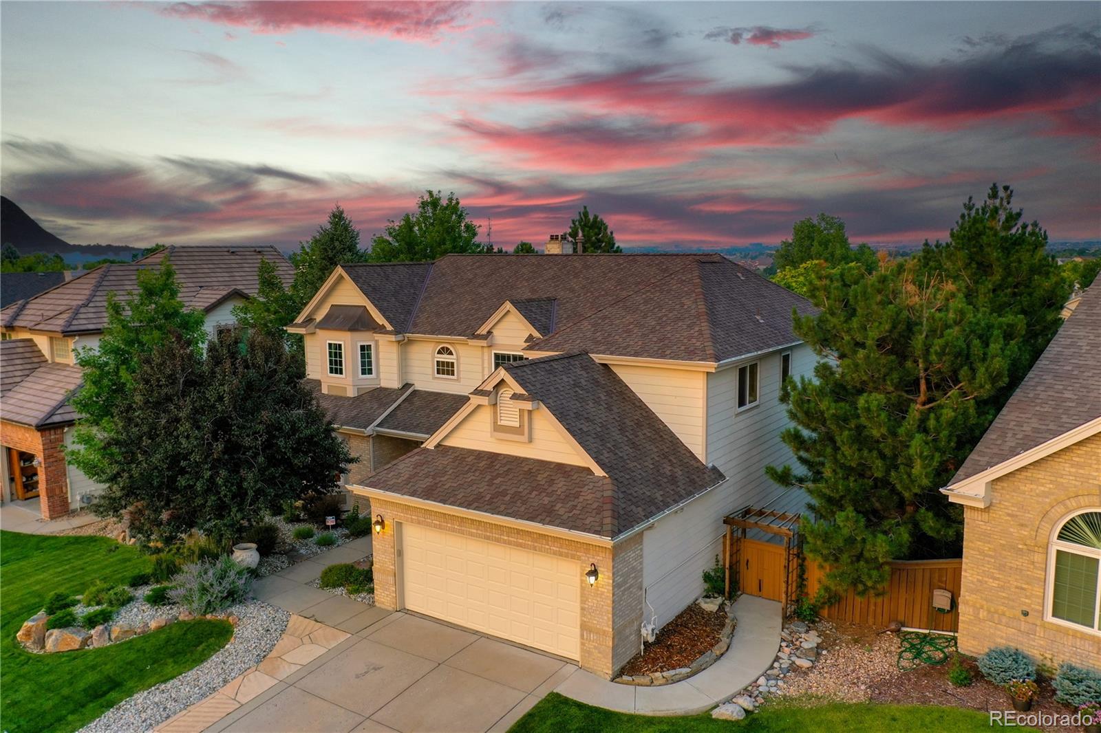 a aerial view of a house with a yard