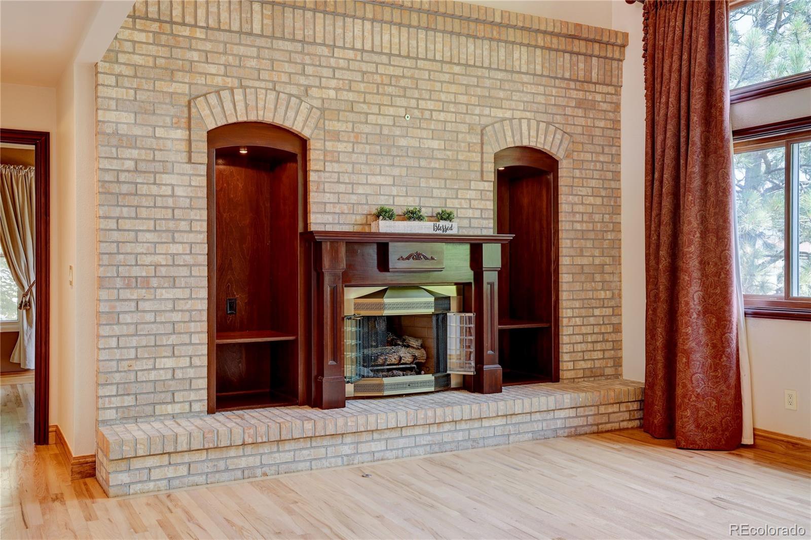 8844 South Forrest Drive Highlands Ranch, CO 80126 - Photo 11 of 40 a front view of a house with glass door and windows