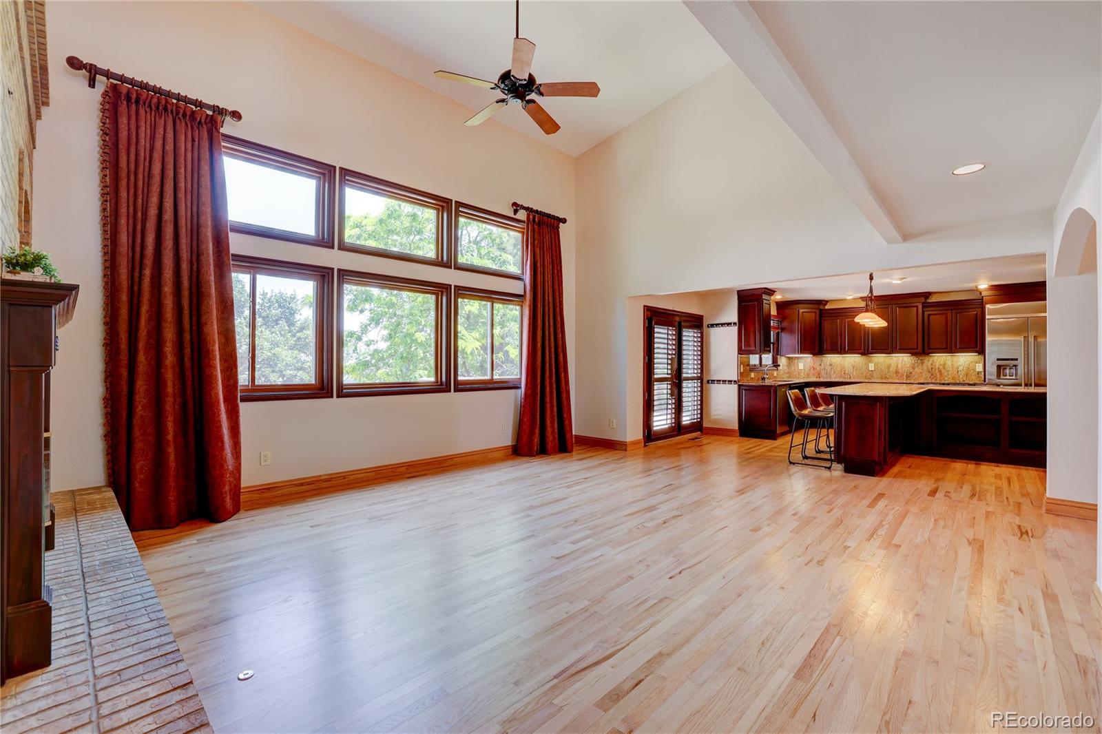 8844 South Forrest Drive Highlands Ranch, CO 80126 - Photo 12 of 40 a view of kitchen with furniture and wooden floor