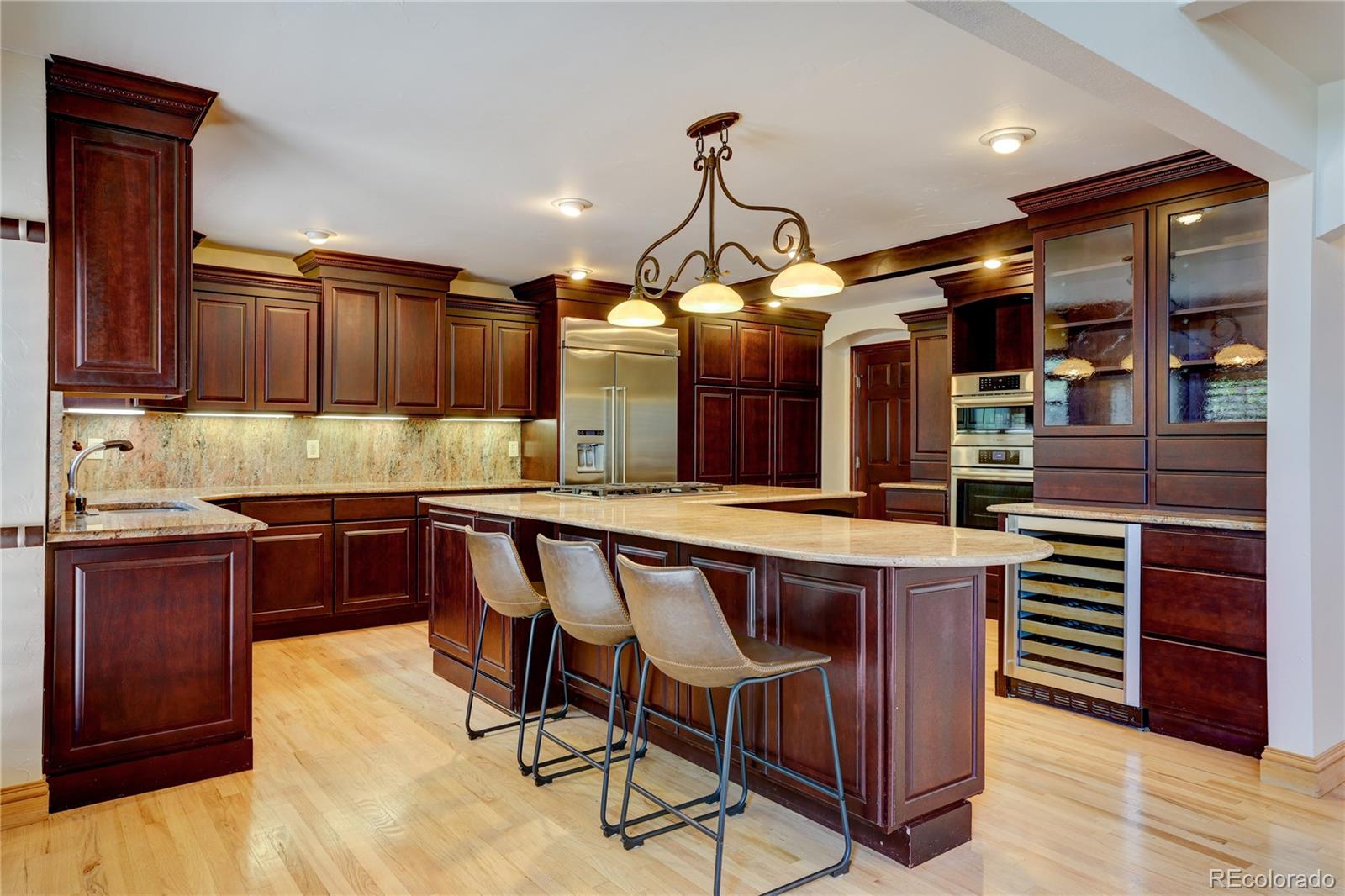 8844 South Forrest Drive Highlands Ranch, CO 80126 - Photo 13 of 40 a kitchen with a sink cabinets and window