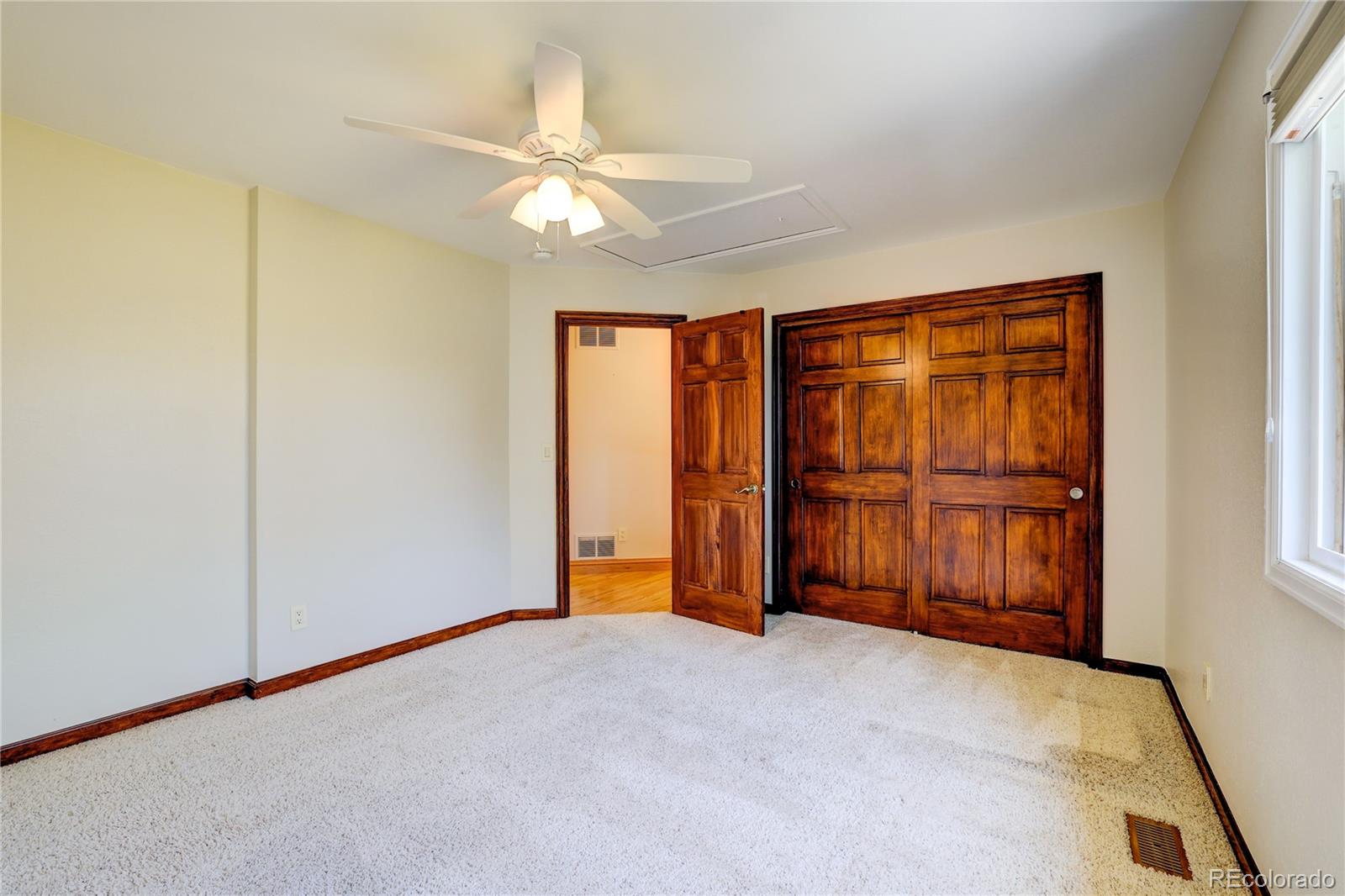 8844 South Forrest Drive Highlands Ranch, CO 80126 - Photo 19 of 40 a view of an empty room with a window