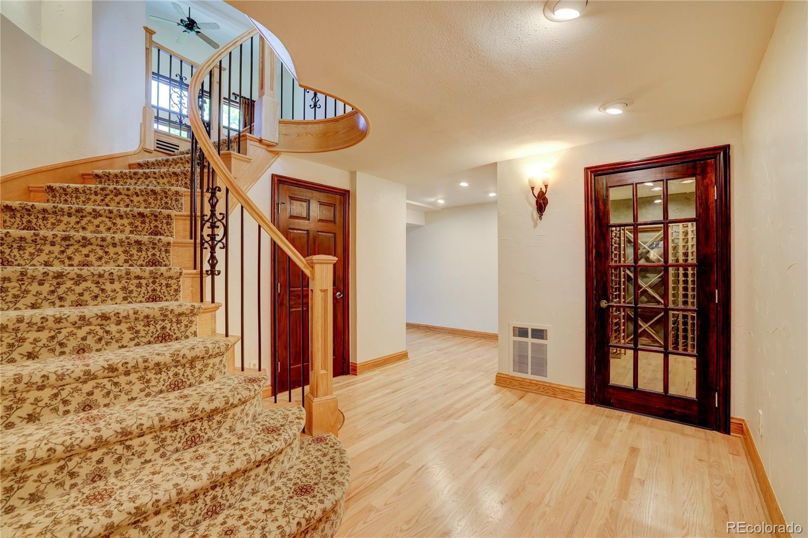 8844 South Forrest Drive Highlands Ranch, CO 80126 - Photo 24 of 40 a view of a hallway with wooden shelves