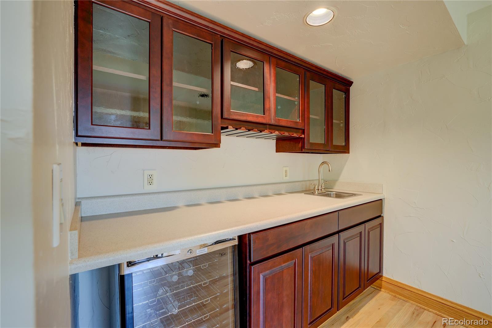 8844 South Forrest Drive Highlands Ranch, CO 80126 - Photo 26 of 40 a bathroom with a sink and a mirror