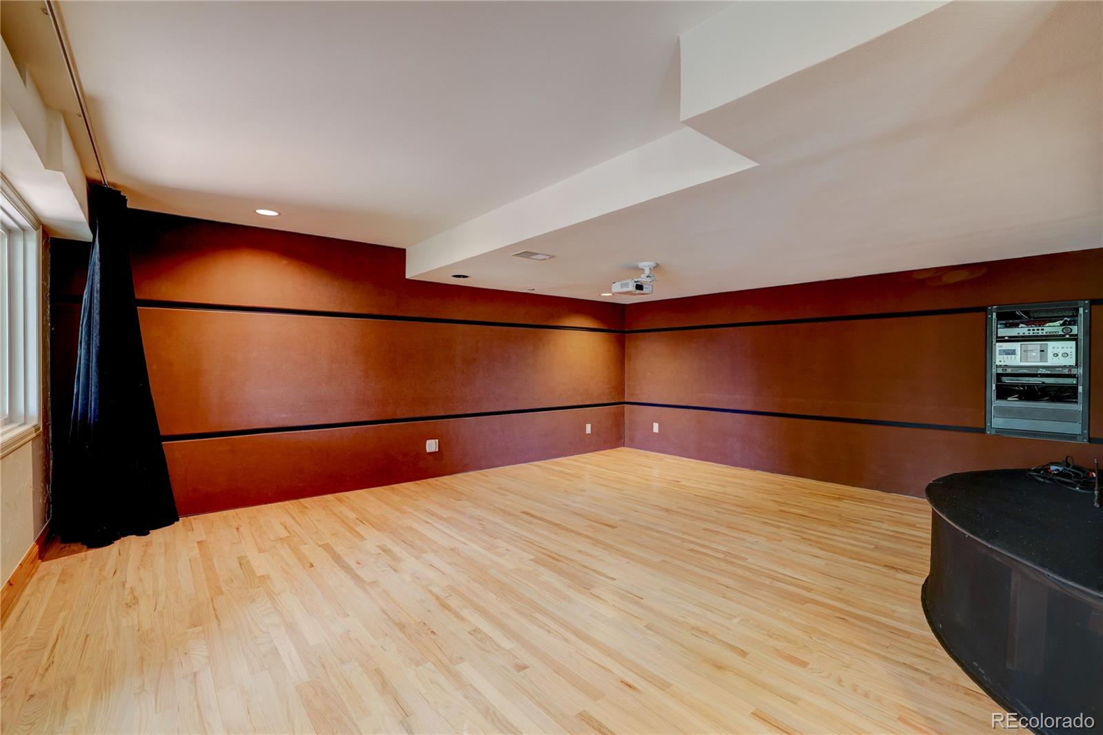 8844 South Forrest Drive Highlands Ranch, CO 80126 - Photo 27 of 40 a bedroom with a bed and a flat screen tv