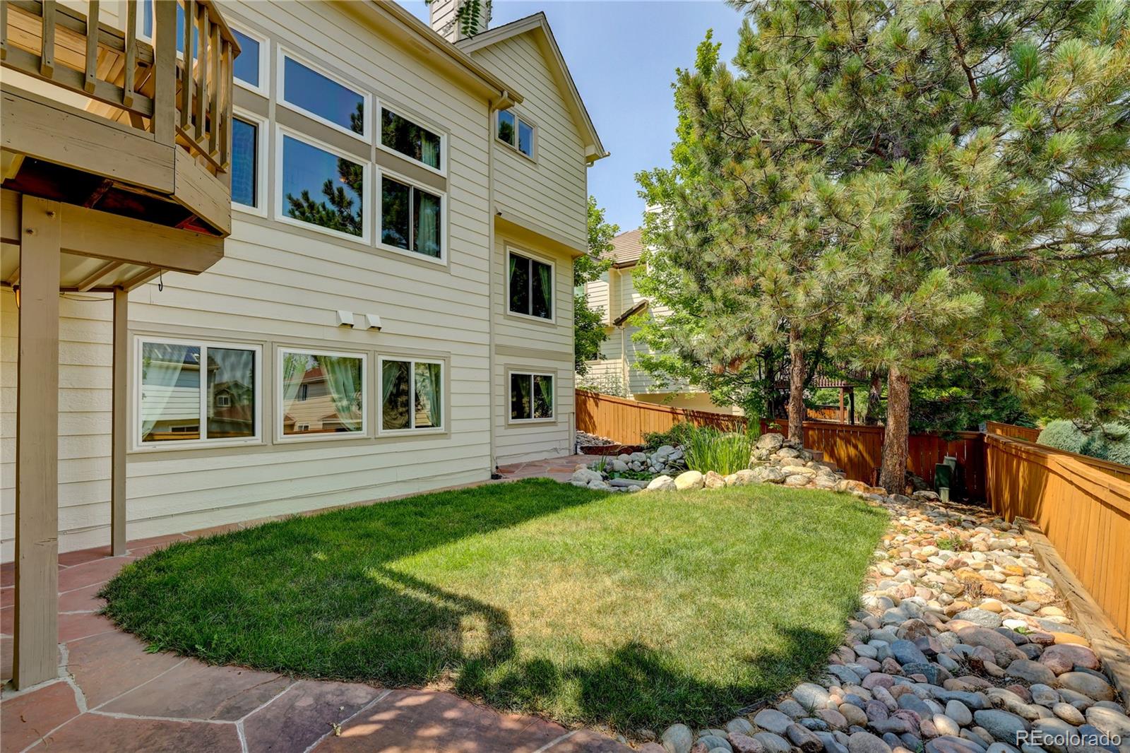 8844 South Forrest Drive Highlands Ranch, CO 80126 - Photo 34 of 40 a view of a house with a yard