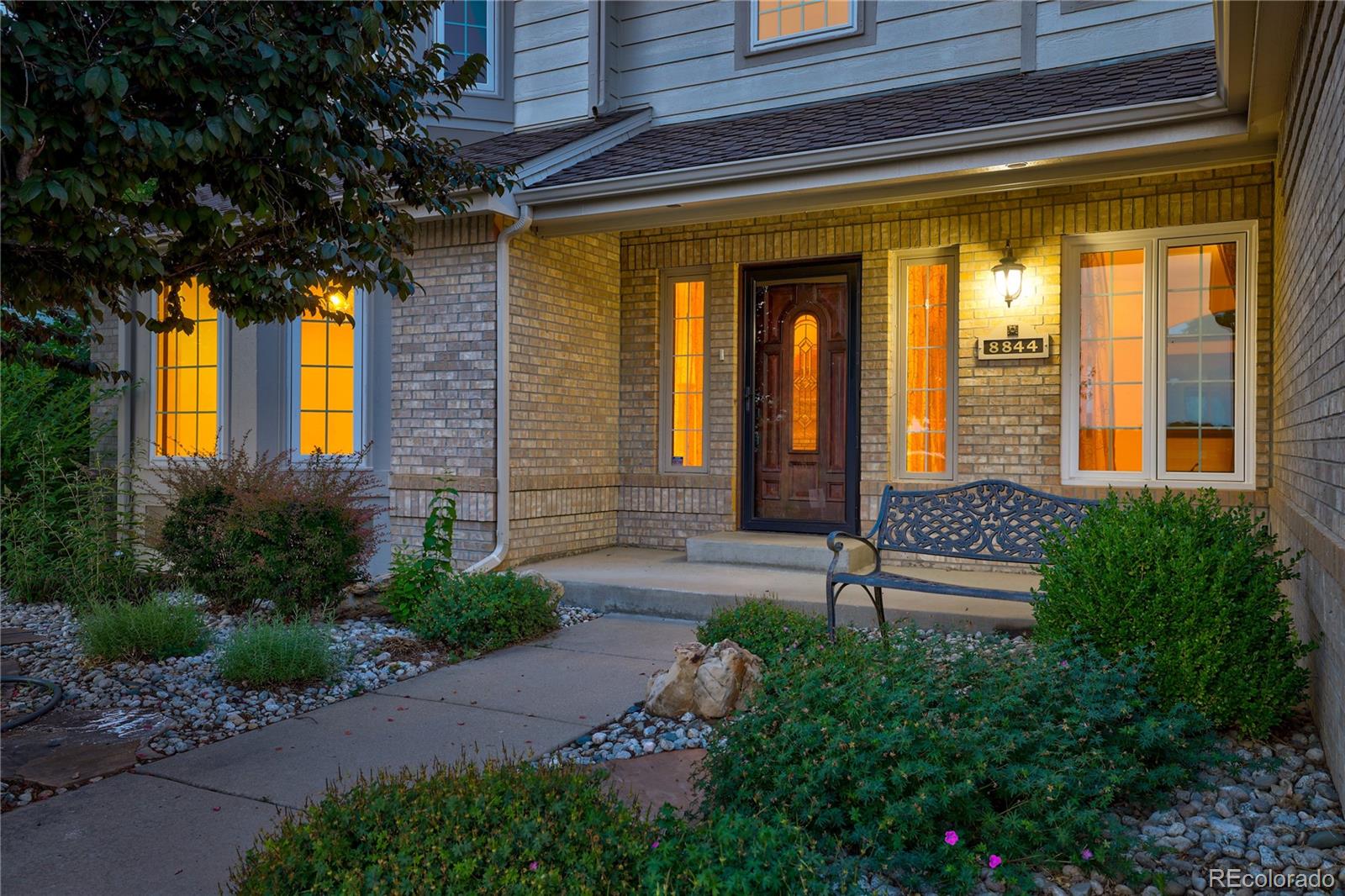8844 South Forrest Drive Highlands Ranch, CO 80126 - Photo 36 of 40 a front view of a house having a yard