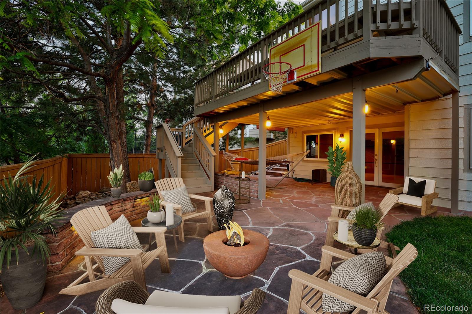 8844 South Forrest Drive Highlands Ranch, CO 80126 - Photo 37 of 40 a view of a patio with couches table and chairs and potted plants