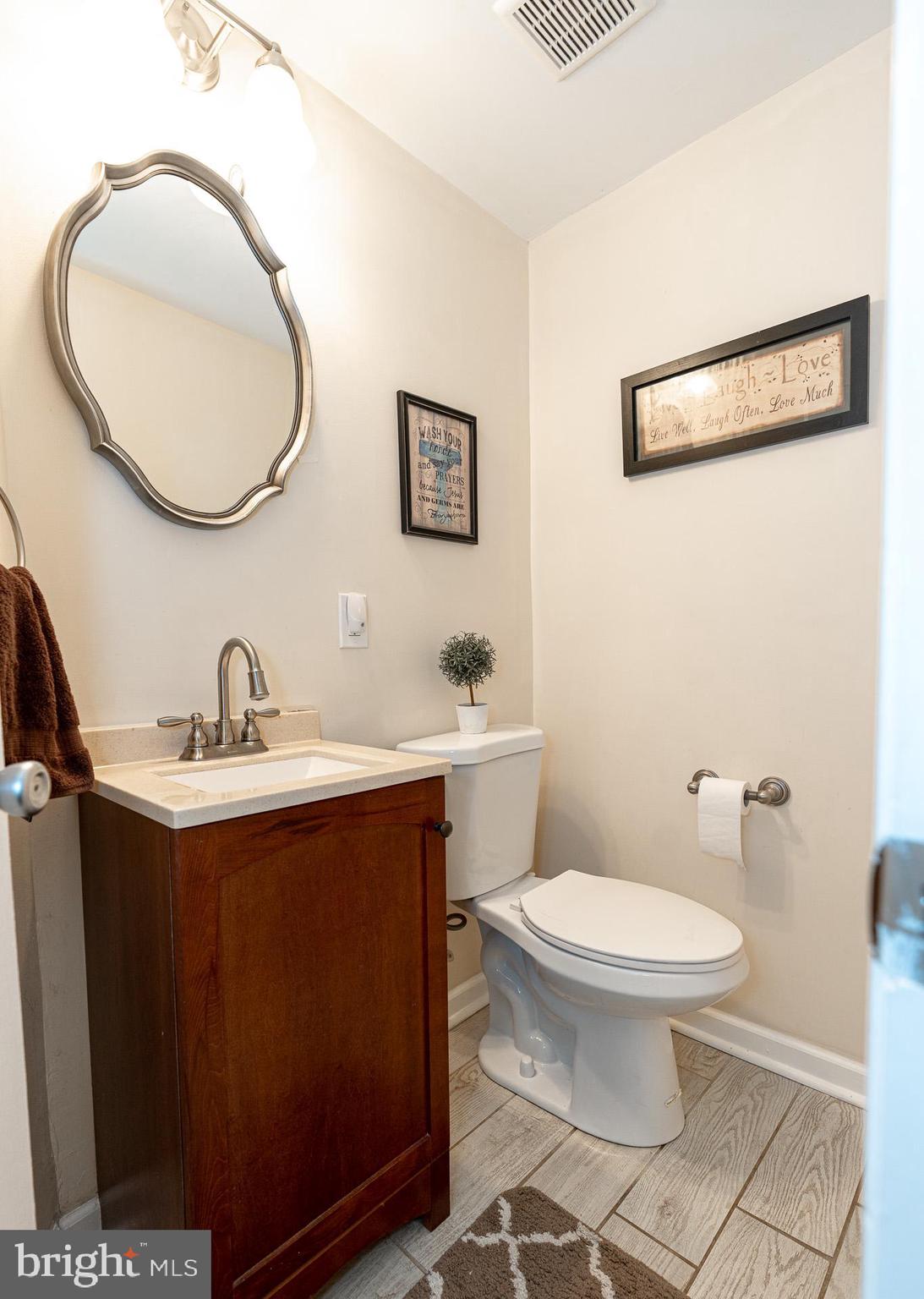 220 Pinewood Road Baltimore, MD 21222 - Photo 13 of 45 a bathroom with a sink and a mirror