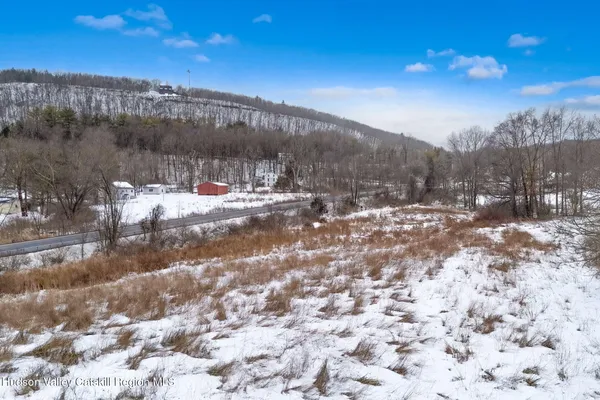 a view of a town with mountains in the background