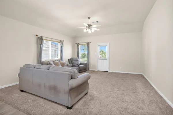 a living room with furniture and a window