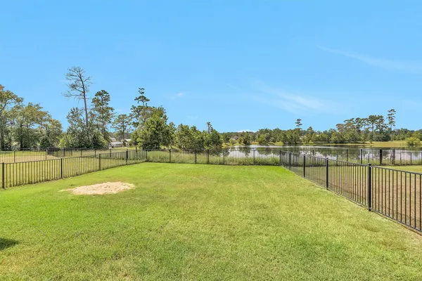 a view of a swimming pool with a yard