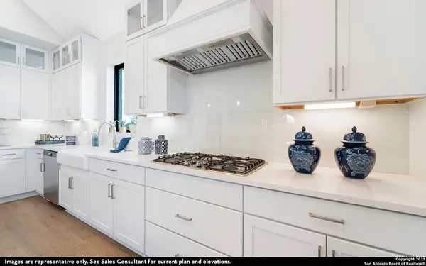 a kitchen with sink and cabinets