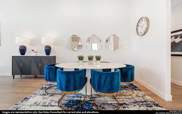 a dining room with table and chairs