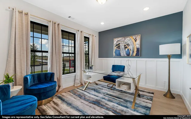 a living room with furniture and a rug
