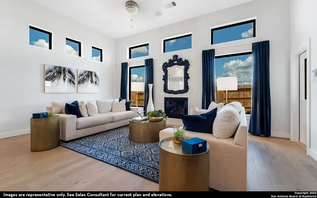a living room with furniture and a floor to ceiling window
