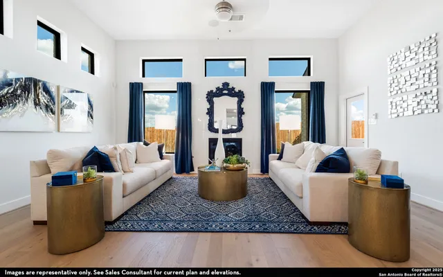 a living room with furniture and painting on the wall