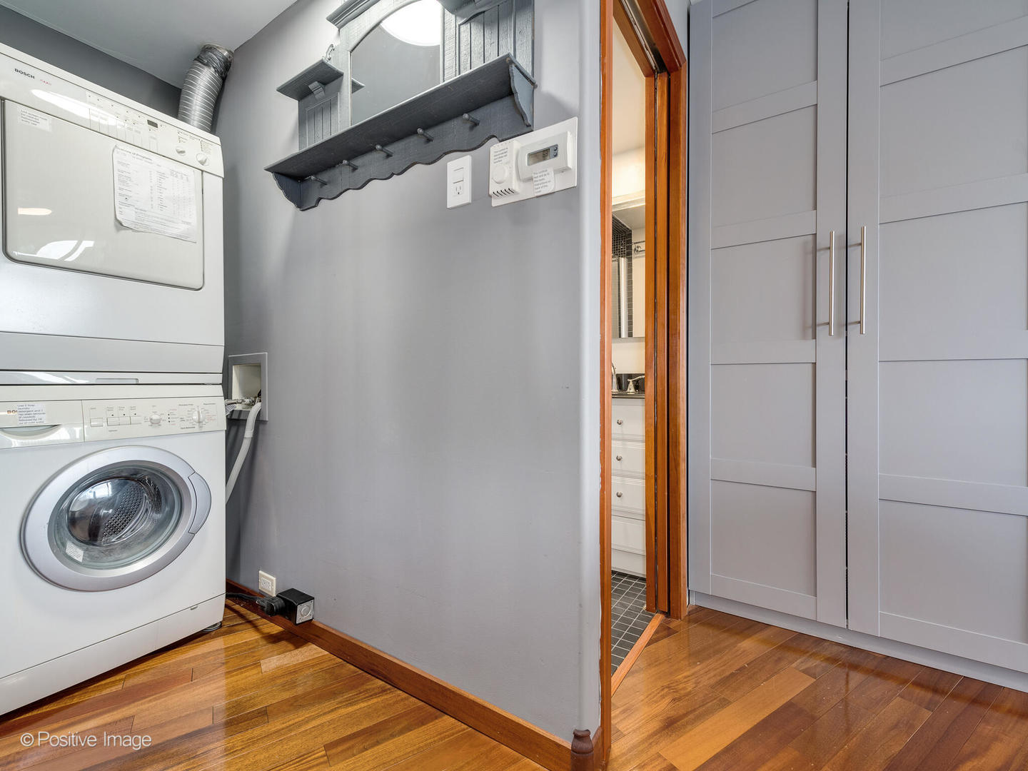 300 North State Street, Unit 5317 Chicago, IL 60654 - Photo 12 of 27 a view of a storage & utility room with a washer dryer