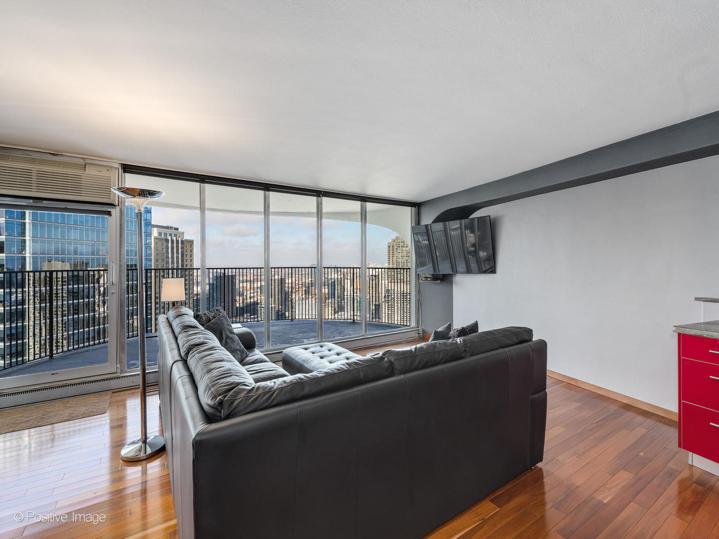 300 North State Street, Unit 5317 Chicago, IL 60654 - Photo 3 of 27 a living room with furniture and a floor to ceiling window