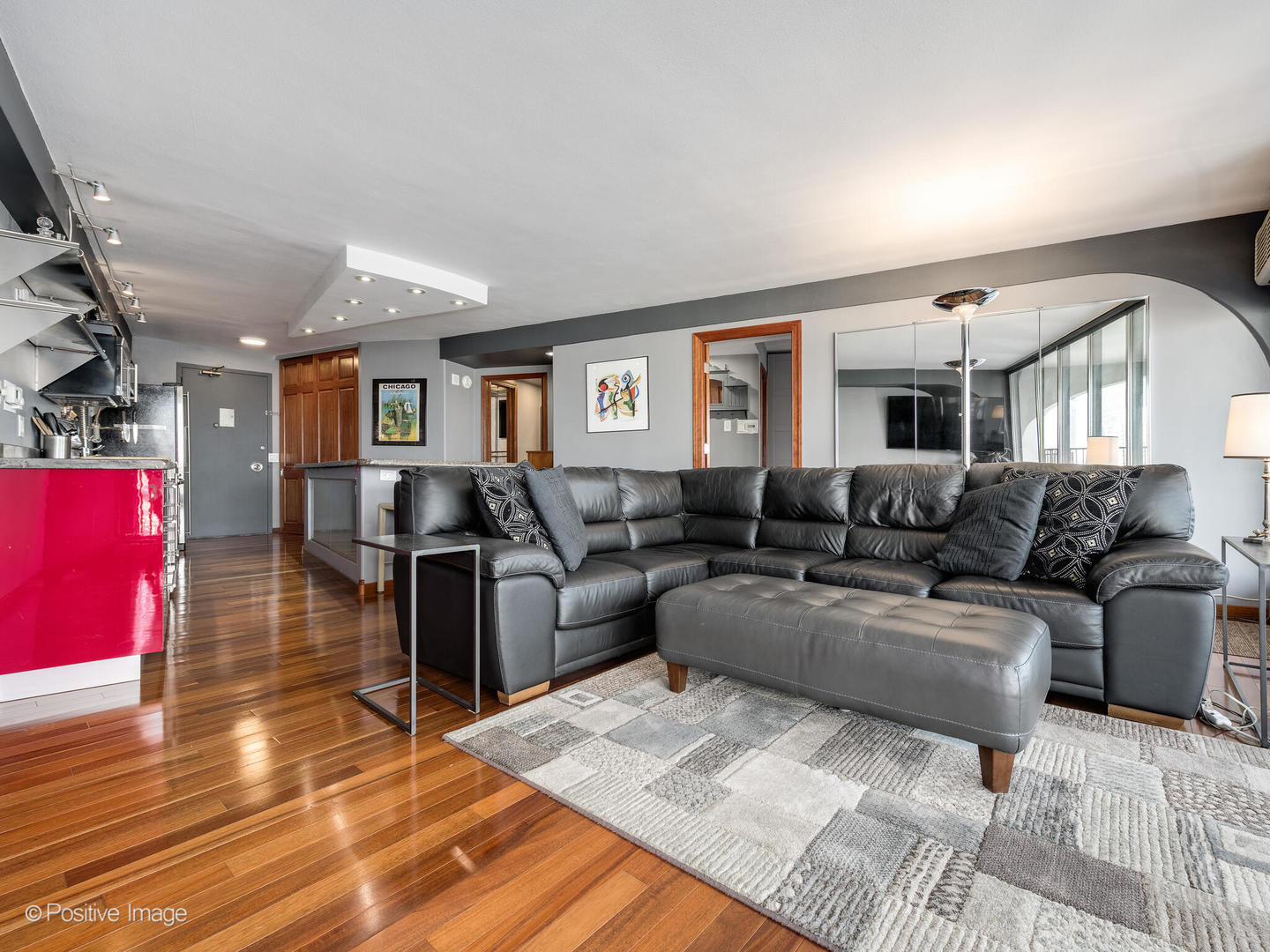 300 North State Street, Unit 5317 Chicago, IL 60654 - Photo 4 of 27 a living room with furniture a rug and a window