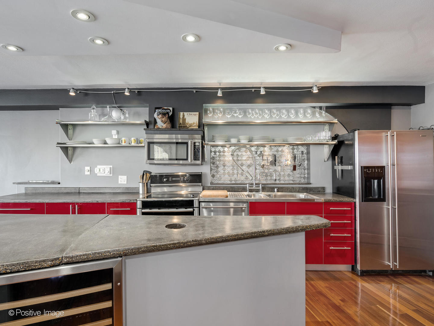 300 North State Street, Unit 5317 Chicago, IL 60654 - Photo 8 of 27 a kitchen with stainless steel appliances granite countertop a sink and cabinets