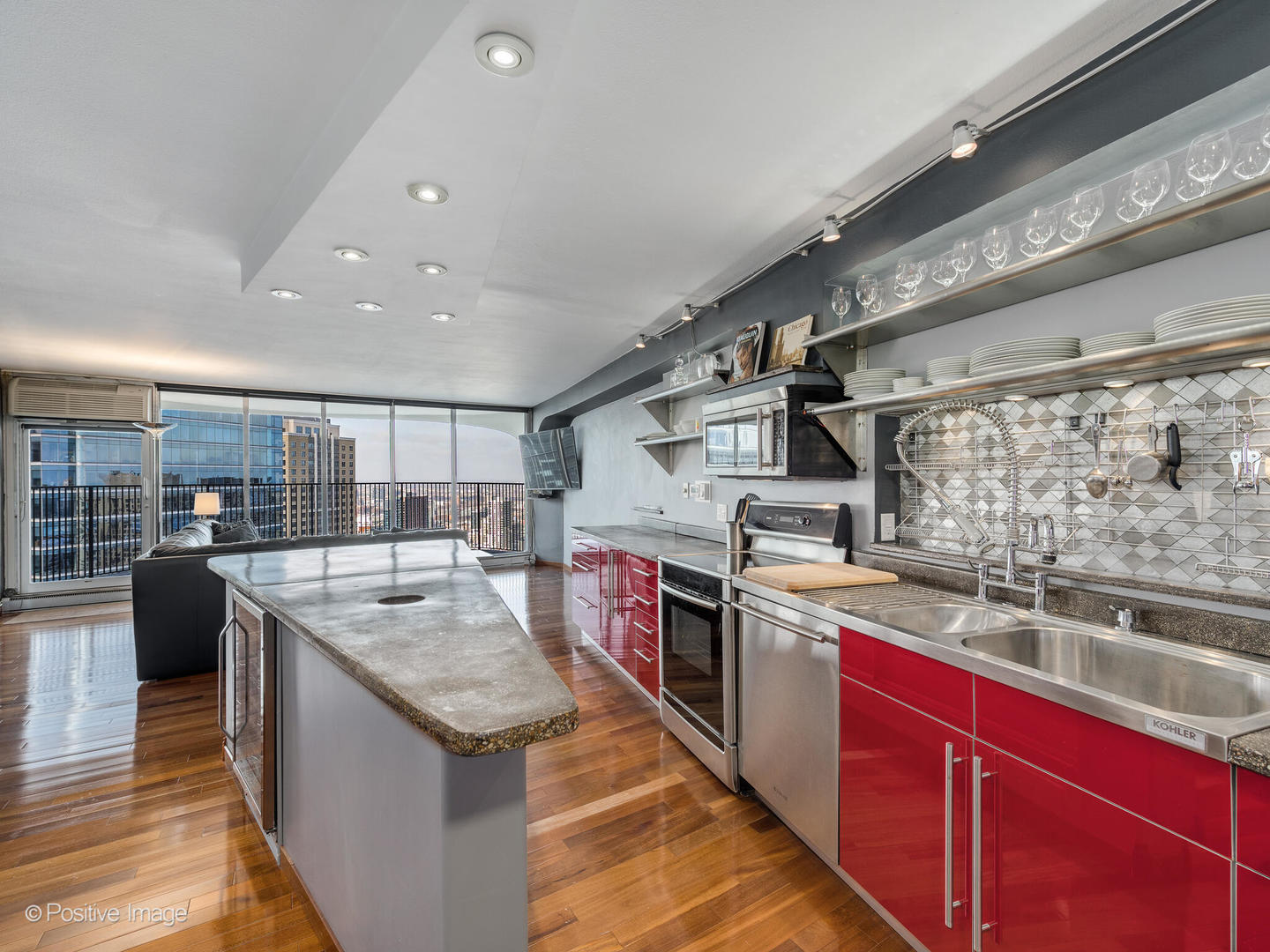 300 North State Street, Unit 5317 Chicago, IL 60654 - Photo 9 of 27 a kitchen with stainless steel appliances granite countertop a sink and stove