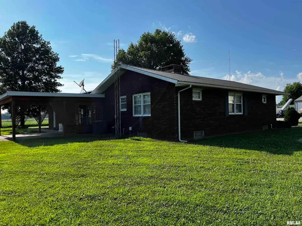a view of a house with a yard and garage