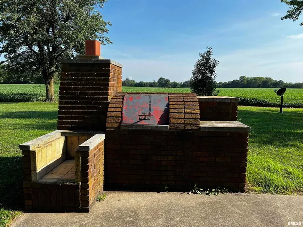 a view of a two chairs in a yard