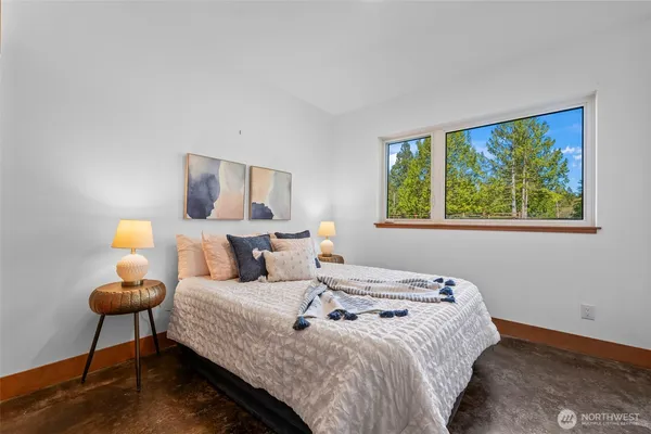 a bedroom with bed and a window