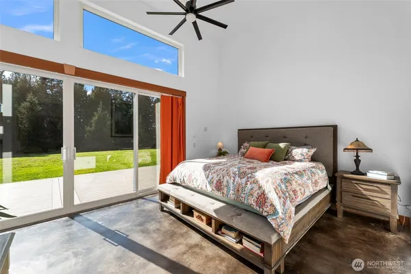 a spacious bathroom with double vanity and a shower
