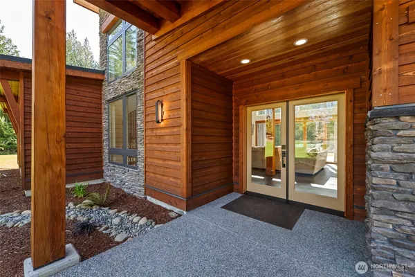 a view of a house with yard and sitting area