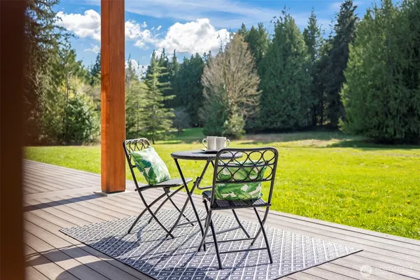 a view of backyard with a garden and entertaining space