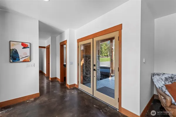 a view of an entryway with wooden floor