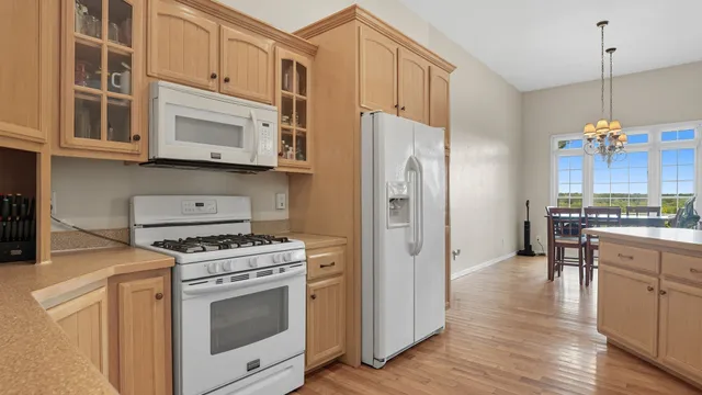 a kitchen with cabinets and appliances