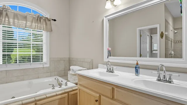 a bathroom with a bathtub and shower