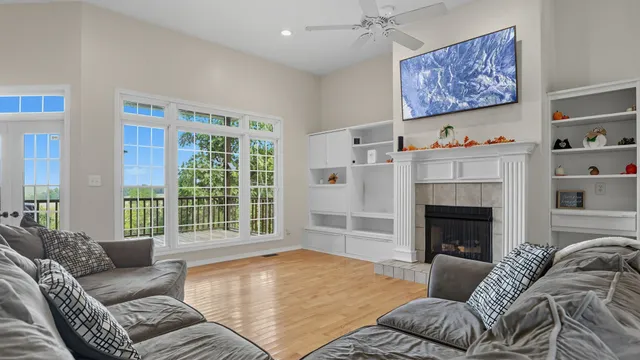 a living room with furniture window and a fireplace
