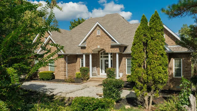 a front view of a house with garden