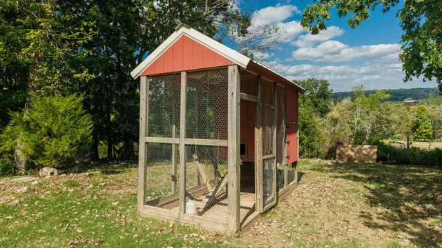 a view of a house with backyard porch and sitting area