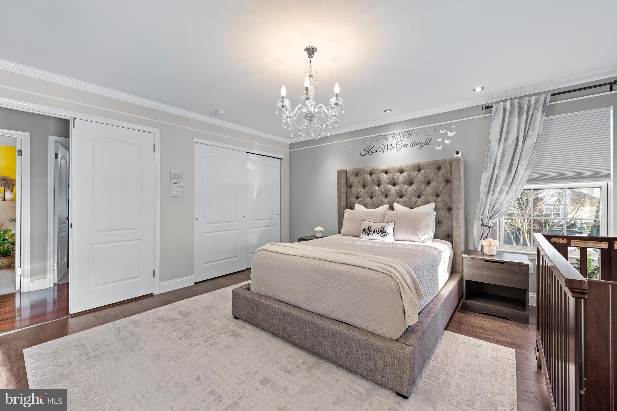 11 Frederick Street Sicklerville, NJ 08081 - Photo 22 of 57 a bedroom with a large bed and a chandelier