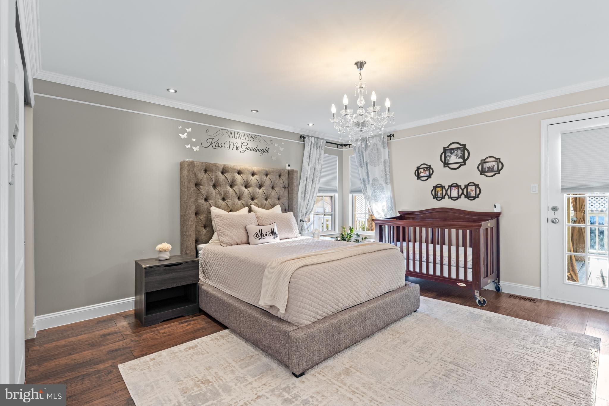 11 Frederick Street Sicklerville, NJ 08081 - Photo 23 of 57 a bedroom with a large bed and a chandelier