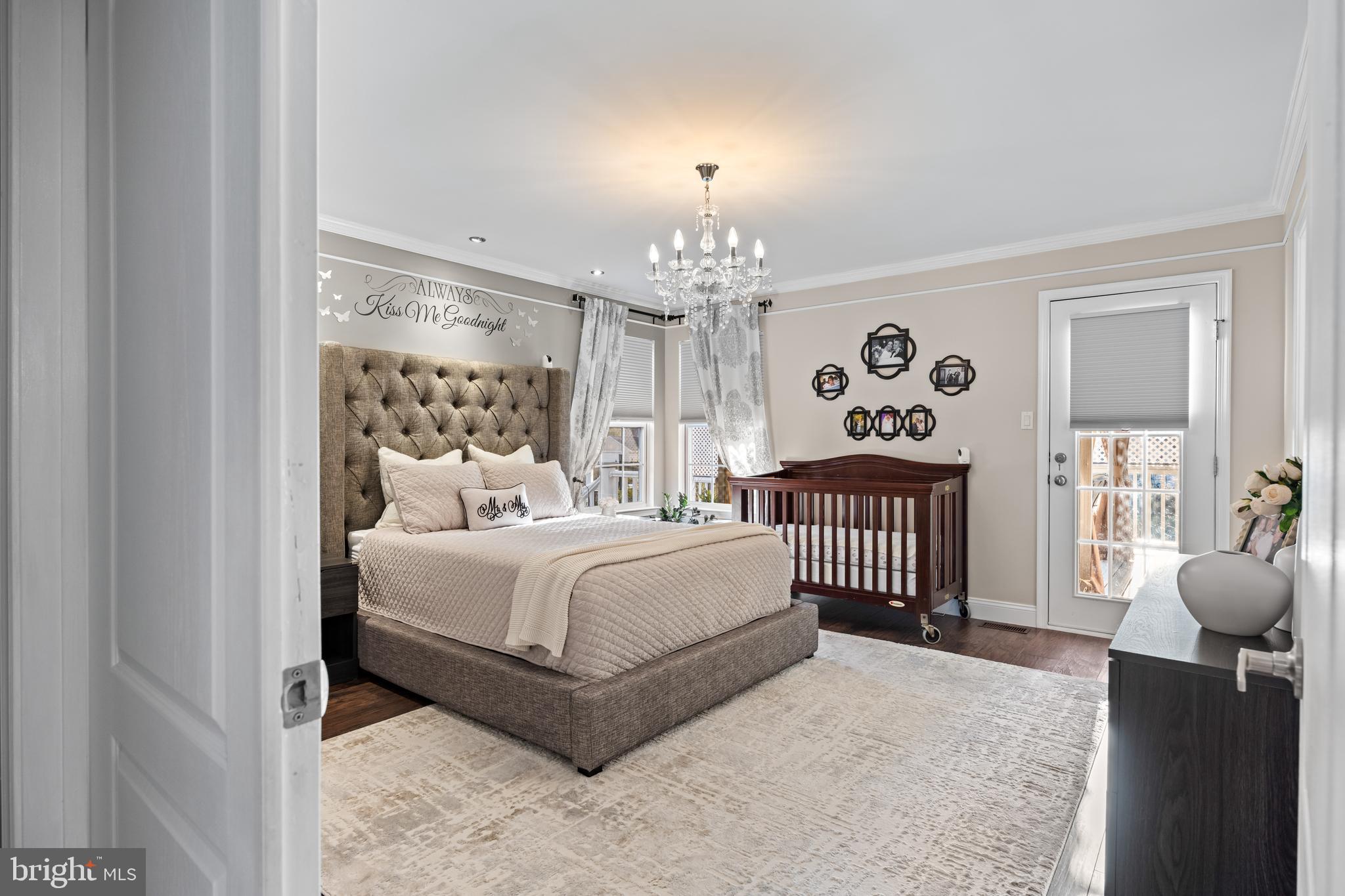 11 Frederick Street Sicklerville, NJ 08081 - Photo 24 of 57 a spacious bedroom with a bed and a chandelier