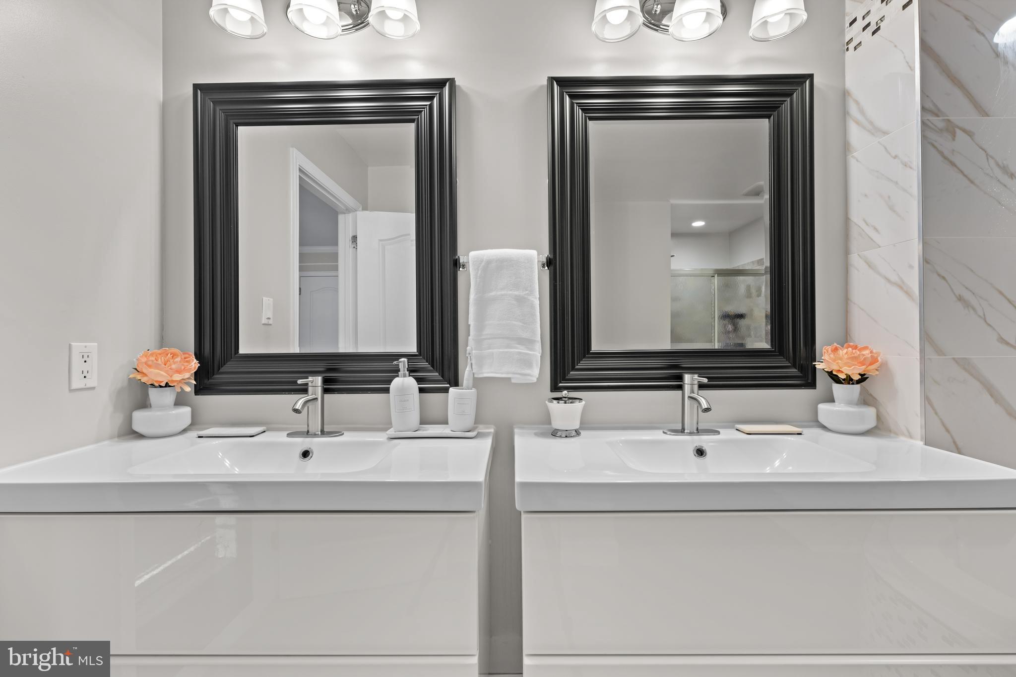 11 Frederick Street Sicklerville, NJ 08081 - Photo 27 of 57 a bathroom with double vanity sinks and a mirror