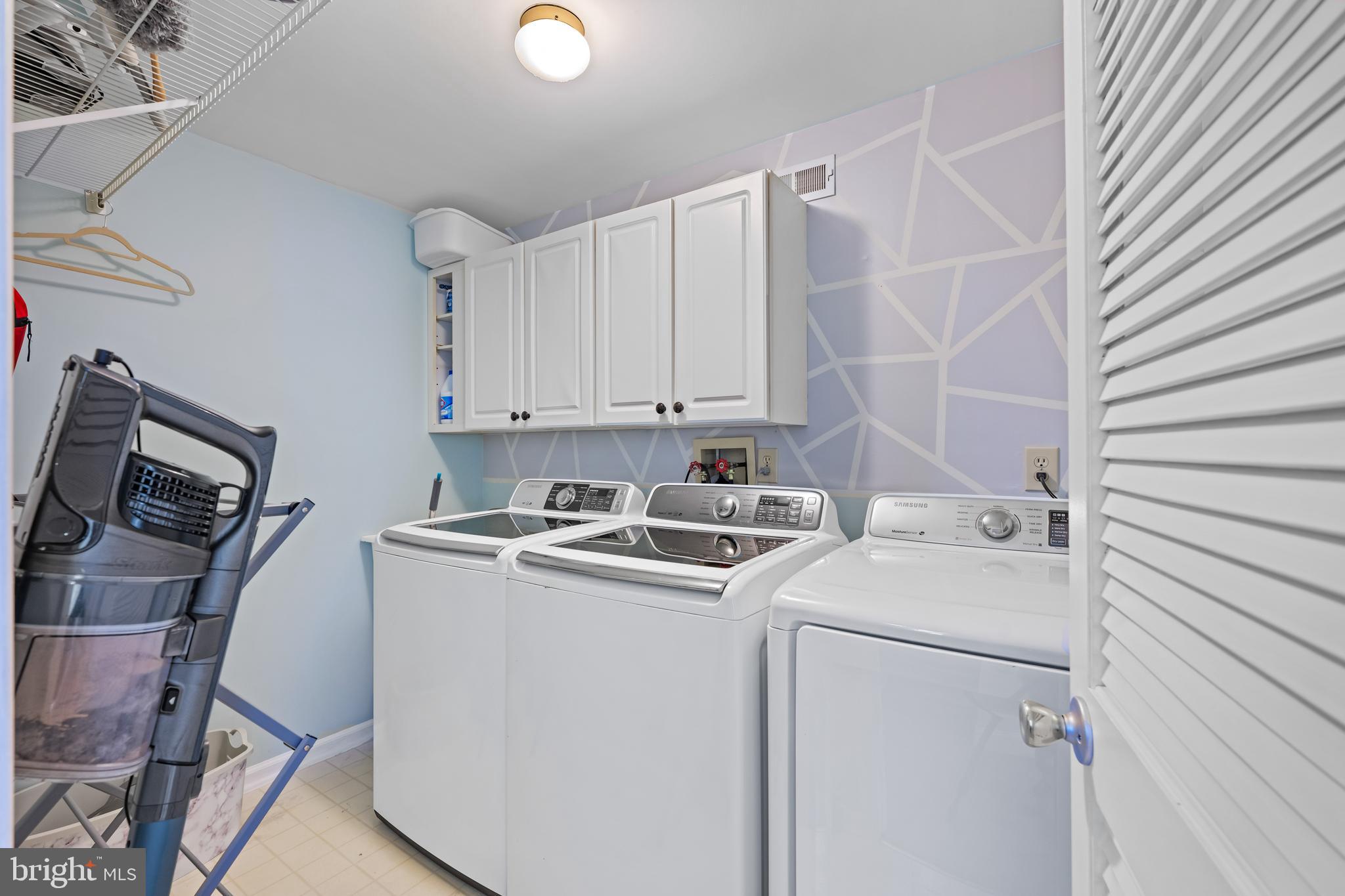 11 Frederick Street Sicklerville, NJ 08081 - Photo 49 of 57 a view of washer and dryer with bathroom in the background
