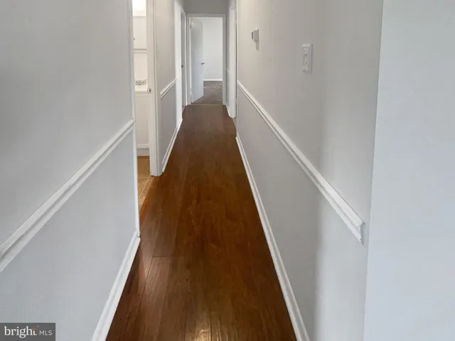 a view of a hallway with stairs