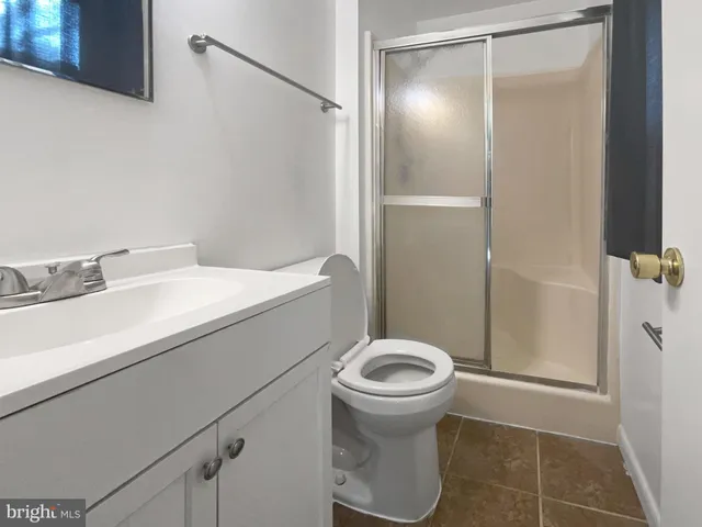 a bathroom with a sink and toilet