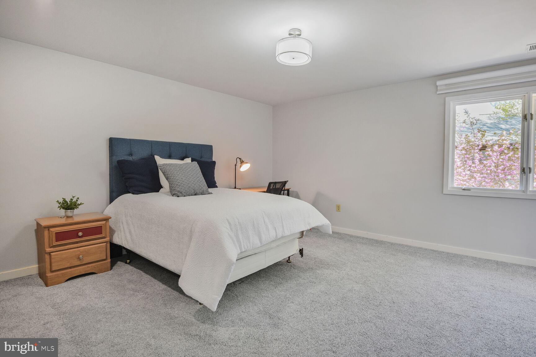 7816 Laurel Leaf Drive Potomac, MD 20854 - Photo 23 of 31 a bedroom with a bed and a window