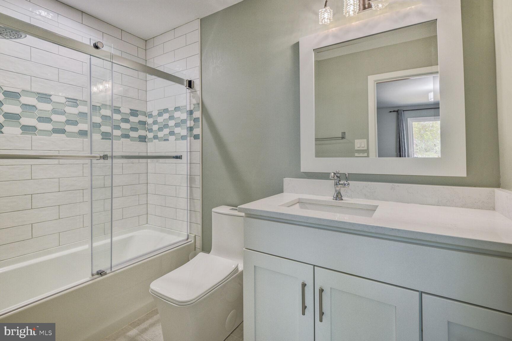 7816 Laurel Leaf Drive Potomac, MD 20854 - Photo 27 of 31 a bathroom with a sink toilet and shower