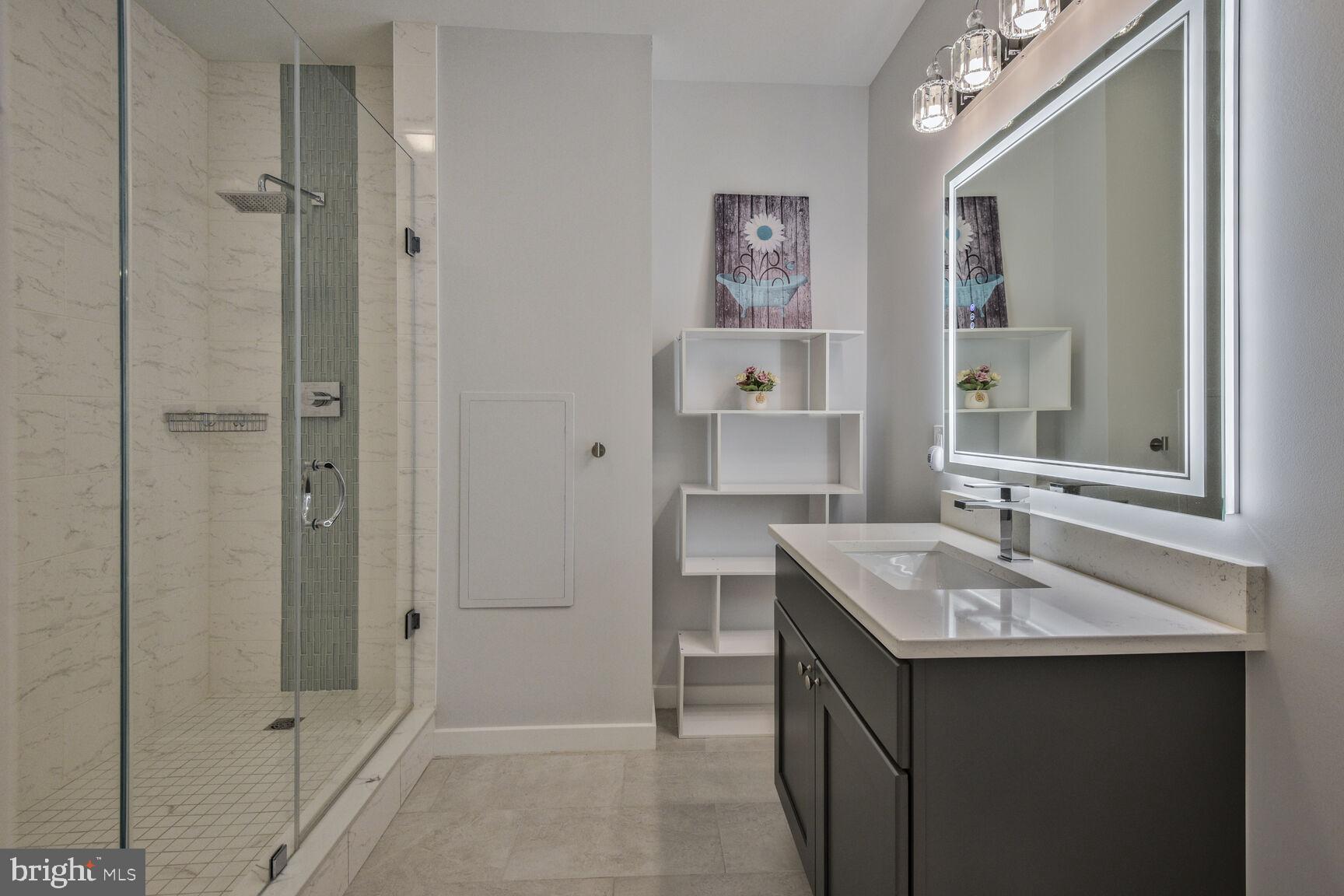 7816 Laurel Leaf Drive Potomac, MD 20854 - Photo 30 of 31 a bathroom with a sink and a mirror