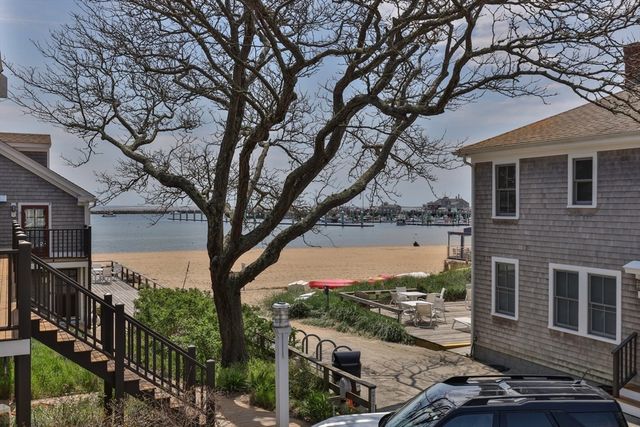 a couple of cars parked in front of a building